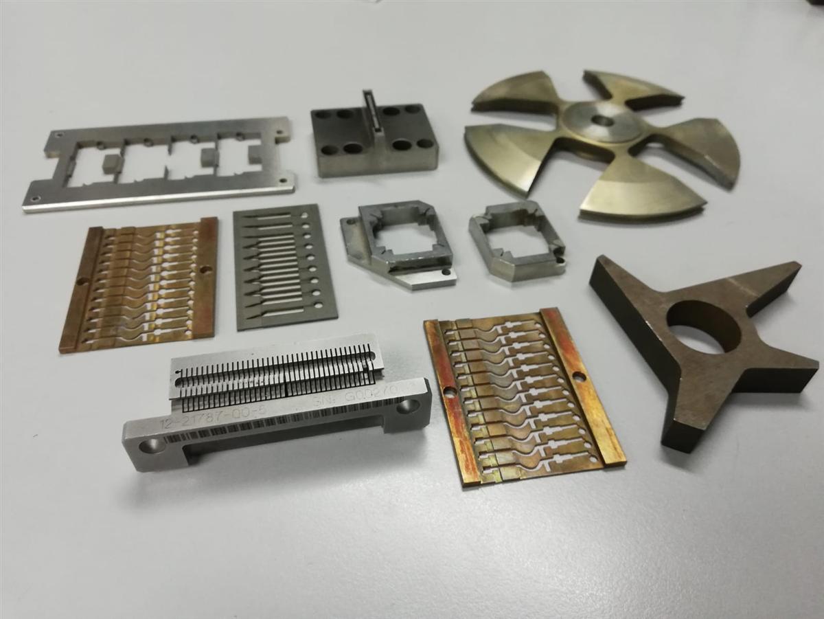Wire-cut precision components including a fan blade and connector plates