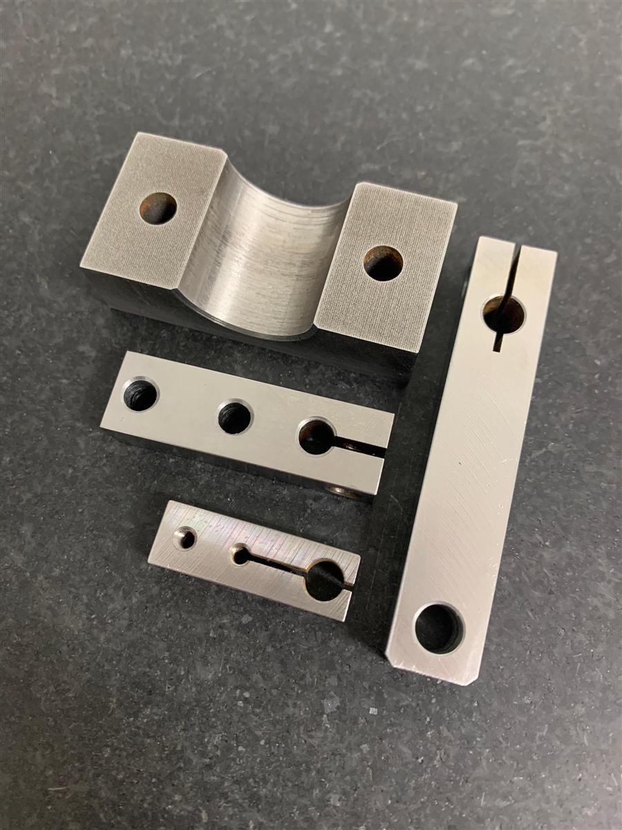 Wire-cut aluminium bracket and clamp components