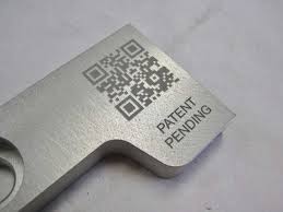 Laser-engraved QR code and patent pending marking on a machined part